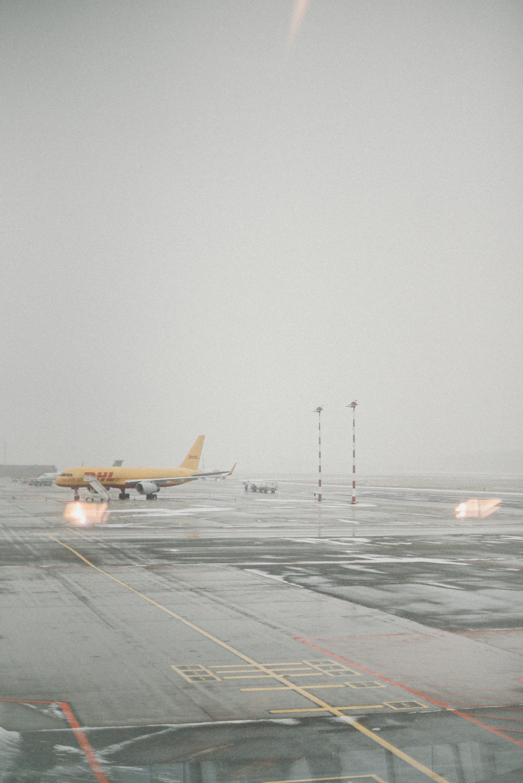 yellow-and-white-plane-on-airport-4551928